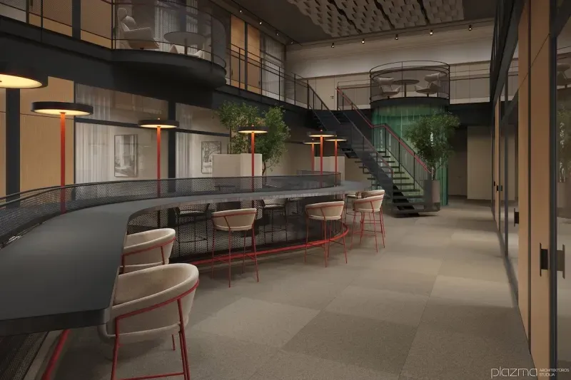 Bar counter with high stools on a mezzanine overlooking the atrium.