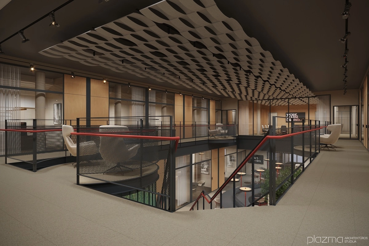 Open floor with glass railings around the atrium void and a red handrail.