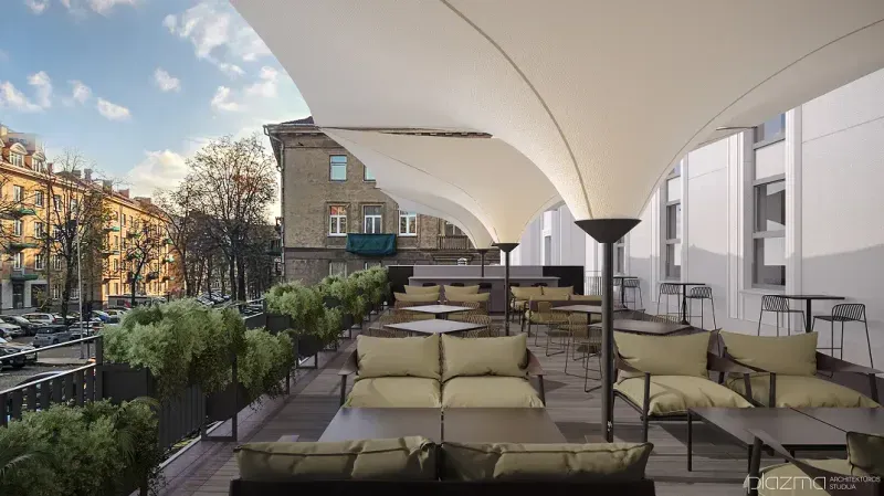 Outdoor terrace with cushioned seating, plants along the railing and white canopies overhead.